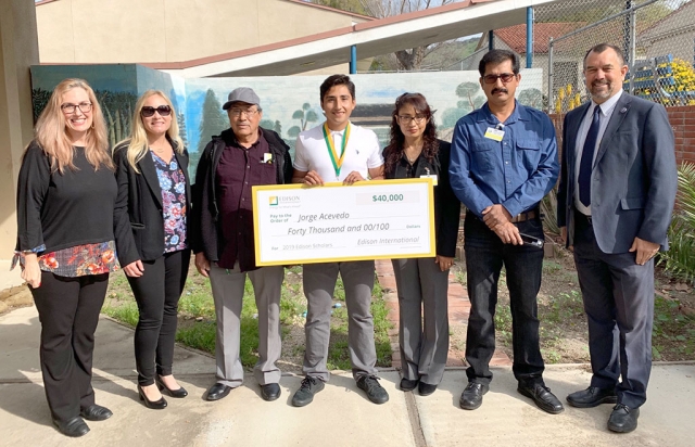 On Tuesday, March 26th at 8:45 a.m., Fillmore High School Senior Jorge Acevedo received a surprise visit from Edison International to be awarded a $40,000 (4 year) scholarship to pursue STEM education. He was one of among 30 scholars to receive $1.2 million in scholarships this year. Jorge Acevedo is a standout track and field and cross country athlete. He plans to dedicate his studies to building technology that helps people maintain and achieve their fitness-related goals. Jorge also serves as a mentor in Big Brothers / Big Sisters, and was awarded the most outstanding student award by Upward Bound Math and Science. Photo courtesy Edison International. 