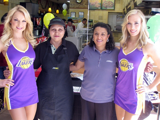 Owner Paully Thiara is pictured above right with Laker girls.