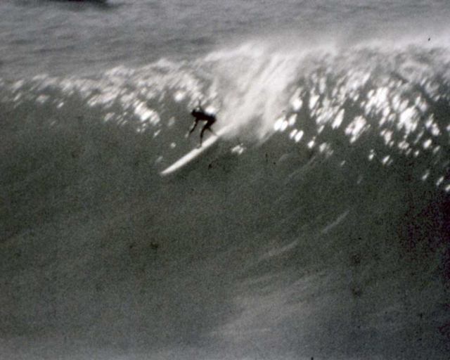 Sarah Gerhardt flies down the face of a wave at Maverick's. (photo: One Winter Story Archive)