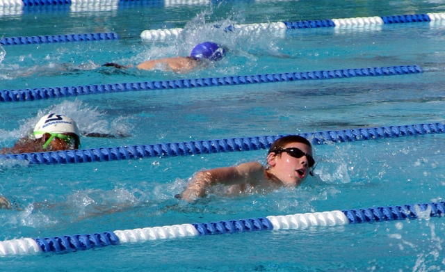 Kyle Popp racing freestyle at the Rio Mesa swim meet.