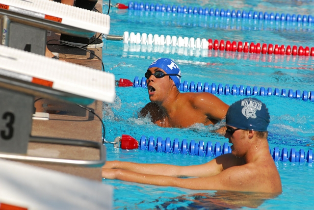 Andres Casas finishes the race against Villanova during last Wednesday’s swim meet.