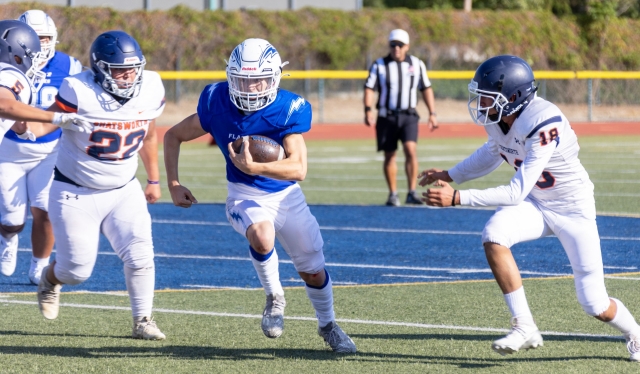 Above is a JV player trying to make his way past the Chatsworth defense to gain yards for the Flashes. Final score, Flashes 20 – Chatsworth 8. Photo credit Crystal Gurrola. 