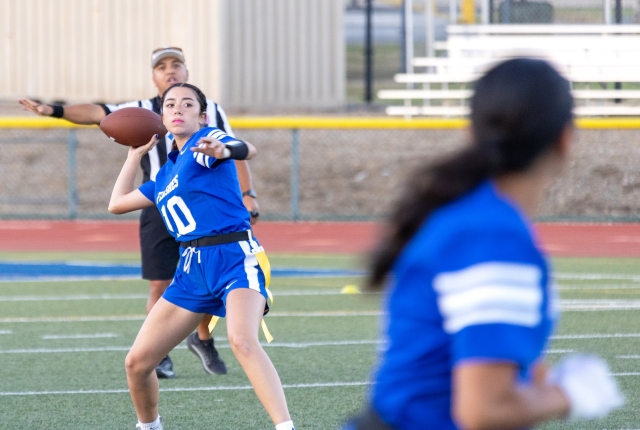 On Thursday night, August 22, the Lady Flashes Flag Football team hosted their first home game and defeated Buena High School, 12–8. Above is the Flashes defense teaming up as they try and stop a Buena player. Below is a Lady Flashes player carrying the ball as she tries to get past the Buena high defense in Thursday night’s game. Photo credit Crystal Gurrola.