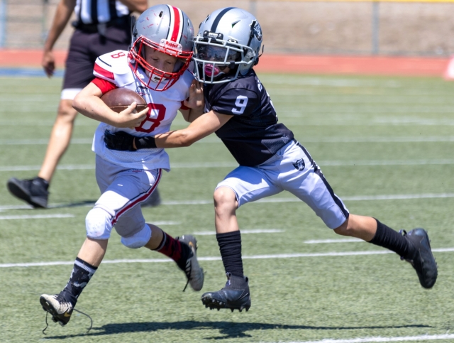 Pictured is Fillmore Raiders Freshman #9 trying to stop a Valley Rush player from advancing. Photo credit Crystal Gurrola. More photos online at www.FillmoreGazette.com.