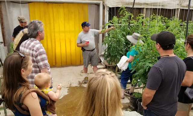 Scott Beylik of Beylik Family Farms speaking with visitors who attended this year’s TomatoFest.