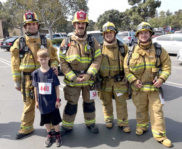 On Saturday, June 3, 2017 four members of the Fillmore Fire Department participated in the Tower to Tower Stair Climb held in Oxnard. They ran 50 floors totaling 1,089 stairs. The run started at the City National Bank tower, and finished at the top of the Morgan Stanley tower. They all successfully completed the activity and the department is very proud of their accomplishment. Picture (l-r) are Brian Evans, Daniel Goguen, Bryan Carreon, Evan Zellmer, and his son James Zellmer. Photo Courtesy Fillmore Fire Department.