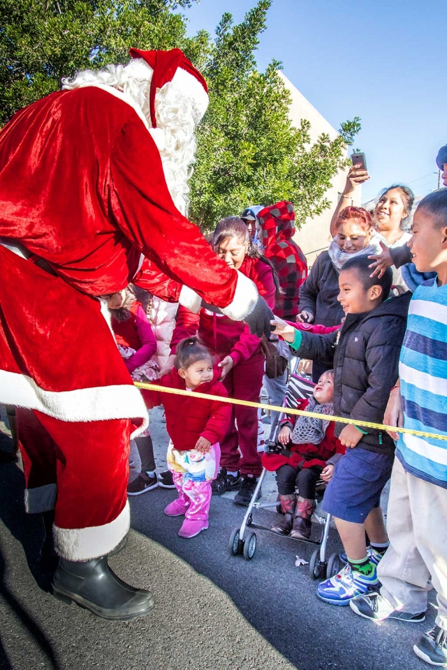 Fire Department Toy Drive a huge success. Exact numbers of children who turned out for the annual Fillmore Fire Department Toy Drive were not available at press time, but from the photos that we received they were in the hundreds. The kids were each given a gift and a winter coat which added to a Merry Christmas. Thanks once again to our Fire Department for their support of this happy event. Photos by Bob Crum.