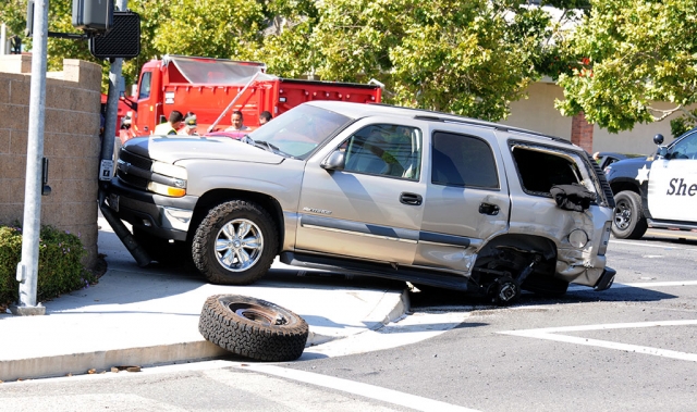 On Monday, July 29th at 3:26 p.m., a two car collision occurred at the corner of River and A Street. When crews arrived they found that a red truck heading north on A Street had collided with a tan Chevy Tahoe that jumped the curb and pinned the traffic light against a concrete wall along A Street. The top half of the traffic light fell into the backyard of a house. Cause of the accident is still under investigation.