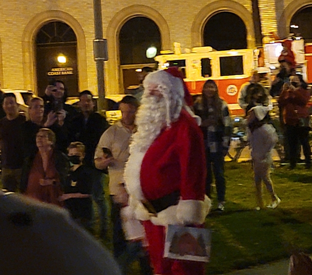Santa was spotted taking a break from handing out candy to enjoy the ceremony.
