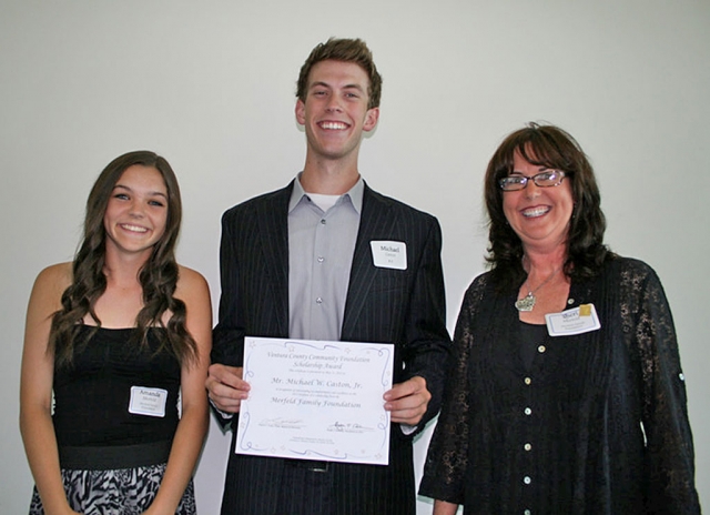 Michael W. Caston, Jr., of Escondido poses with Sheri Merfeld, left, and Amanda Merfeld, both of the Conejo Valley. Caston is the first winner of the Merfeld Family Scholarship at VCCF which is awarded to a student whose parent has been diagnosed with ALS - also called Lou Gehrig's disease. Greg Merfeld, who died from the disease in January of this year, started the scholarship after his own diagnosis with the fatal disease. Photo by Katrina Maksimuk.