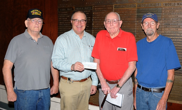 On Friday morning, October 11th, at the Fillmore Veterans Memorial Building, John Pressley of Fillmore donated a check for $1,000 to the Veterans Memorial building fund towards the roof repairs needed for the building.