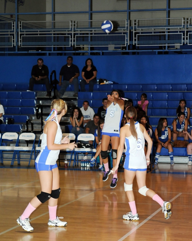Ashley Coert #5 sets the the ball for her teammates, Coert also had 5 kills, 1 block and 1 serving ace.