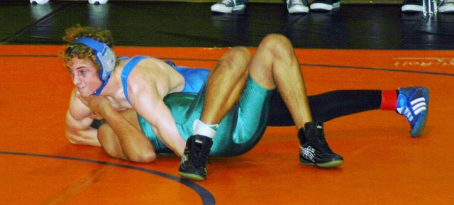 Christian Conaway wrestles his opponent. Conaway won by a pin. Fillmore lost by one point for the Tri -Valley League Title. Fillmore will host the Tri-Valley League Finals on February 5th at 4:00 pm at the F.H.S. Gym.