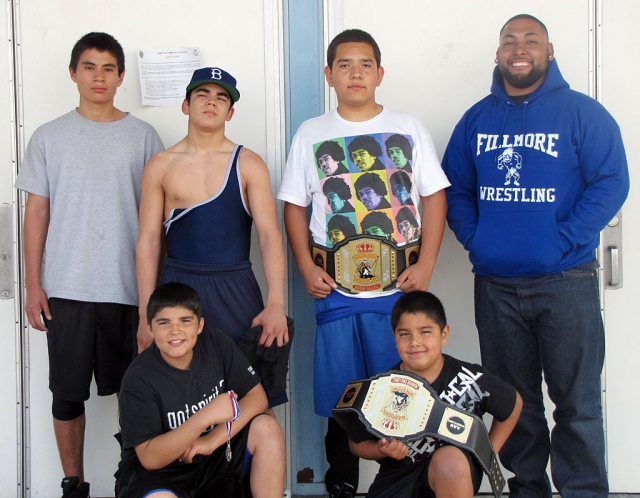 On March 28th 5 wrestlers from Fillmore competed in the Warriors Challenge in Norwalk. Pictured above (l-r) Alex Rivera competed in the 16 year old bracket at 135 pounds, Robert Bonilla wrestled as a 15 year old at 125 pound, Rafael Hernandez wrestled as a 14 year old at 192 pounds, taking first place, Coach David Navarrete. Bottom row (l-r) Andrew Bonilla wrestled as a 13 years old at 125 pounds took 2nd place and Adrian Bonilla wrestled as an 8 year old and first place in the 105 pounds bracket. If you are interested in joining the team please call 805-794-5951, and speak with Jorge Bonilla.