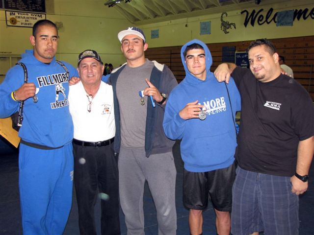 Fillmore Flashes Wrestling team participated in the 10-Way Tournament this past Weekend. Pictured (l-r) Marco Vega, placed second in Heavy Weights, Coach Rob Calderon, Sammy Orosco placed first at 220lbs, Robert Bonilla placed second at 138lbs, and Coach Manual Ponce. Congratulations boys.