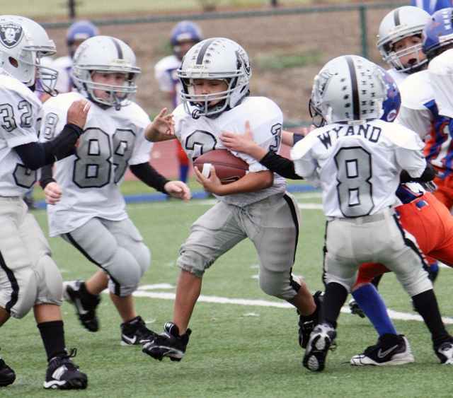 Ty Wyand #8 helps block for his teammate #3.