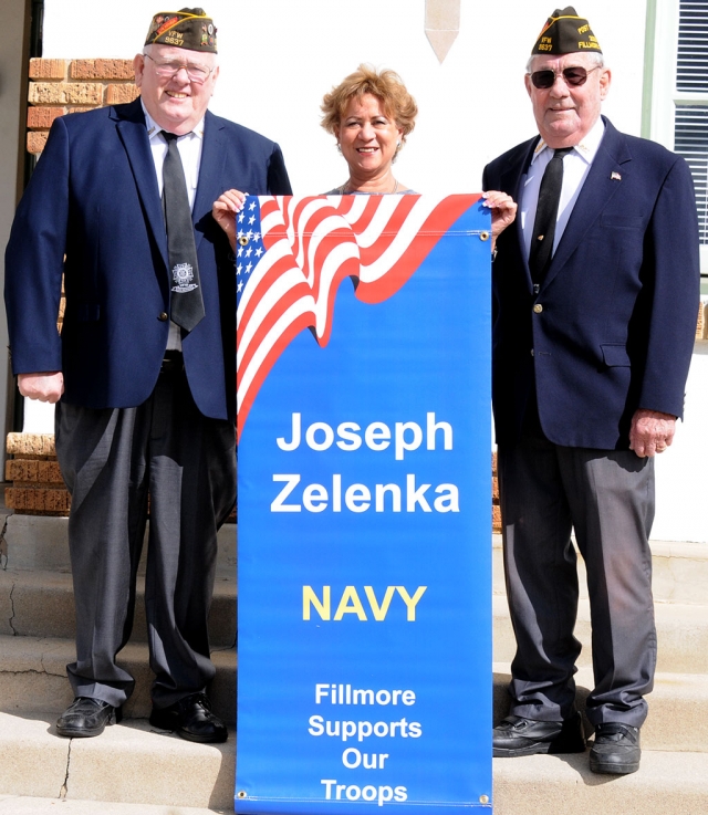 A military banner installation was held on Tuesday morning, March 28th in front of the Fillmore Unified School District office. Joseph Zelenka’s family was presented with a banner in honor of his naval service. Pictured is his mother and members of Fillmore’s VFW Post 9637.