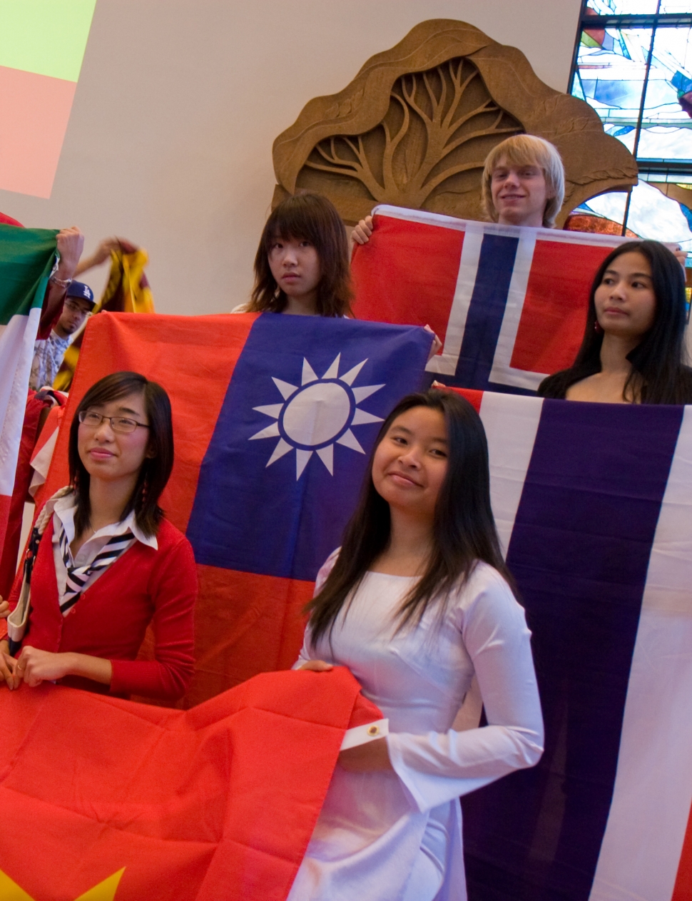 Students with their flags at the International Chapel Service. Photo credit: Brian Stethem