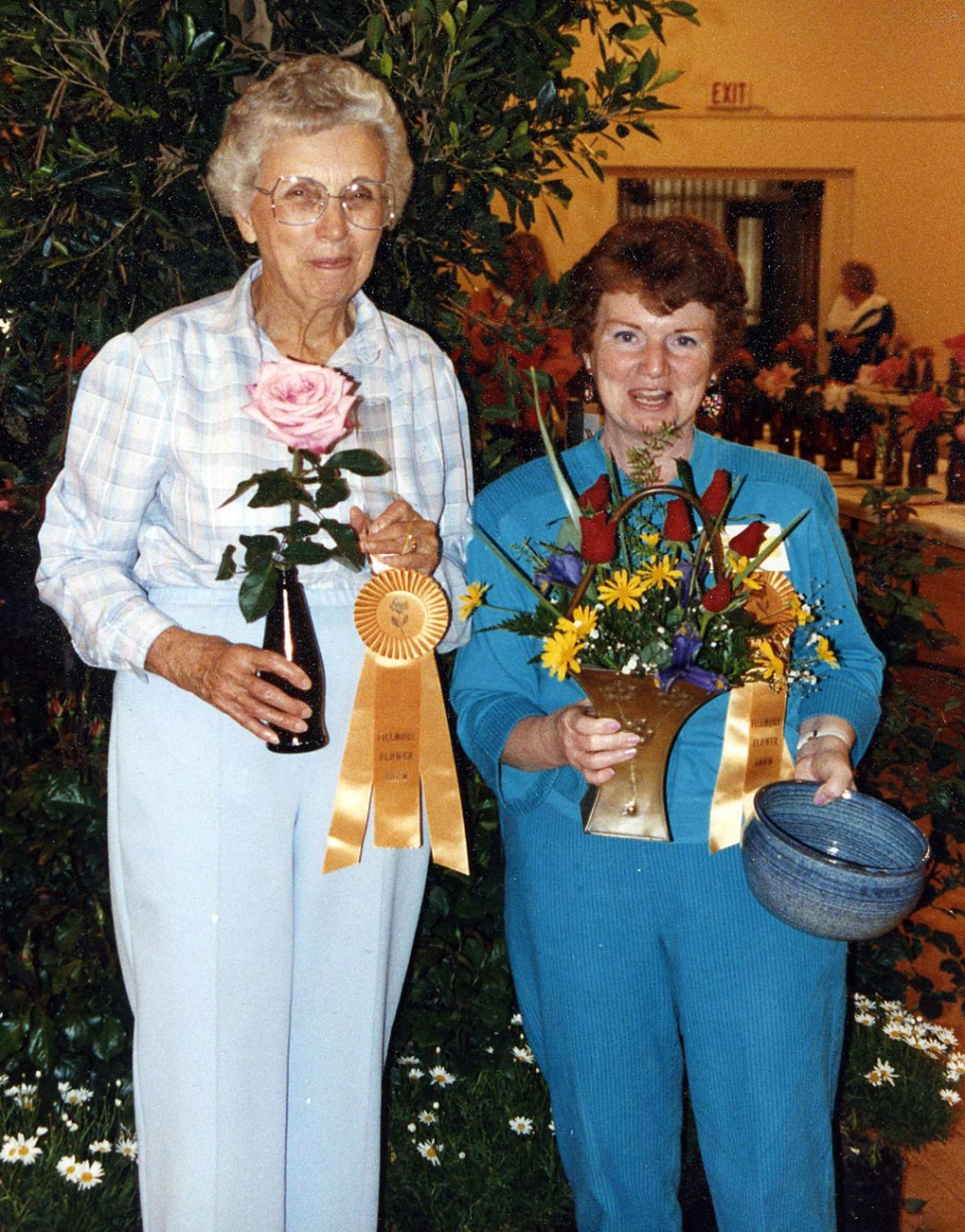 Marie Dennis (left) won Best Rose with ‘Aquarius’ and Judy Dunst won Best Arrangement at the 1990 Fillmore Flower Show.