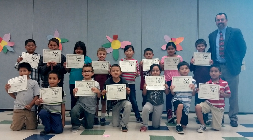 Picture 2nd and 3rd Grades Readers and Writers of the Month at Mountain Vista School. Pictured are Sergio Gomez, David Reyes, James Latshaw, Christian Tafoya, Pedro Alfaro, Isaac Esparza, Ximena Arzola, Phillip King, Jackson Resor, Lucero Tirado Perada, Leslie Ortiz, Isaac Munoz Garibay, Joseph Albanez, Isaac Reyes Recendez, Alejandra Martinez, and Antonio De la Cruz, with Principal John Wilber.