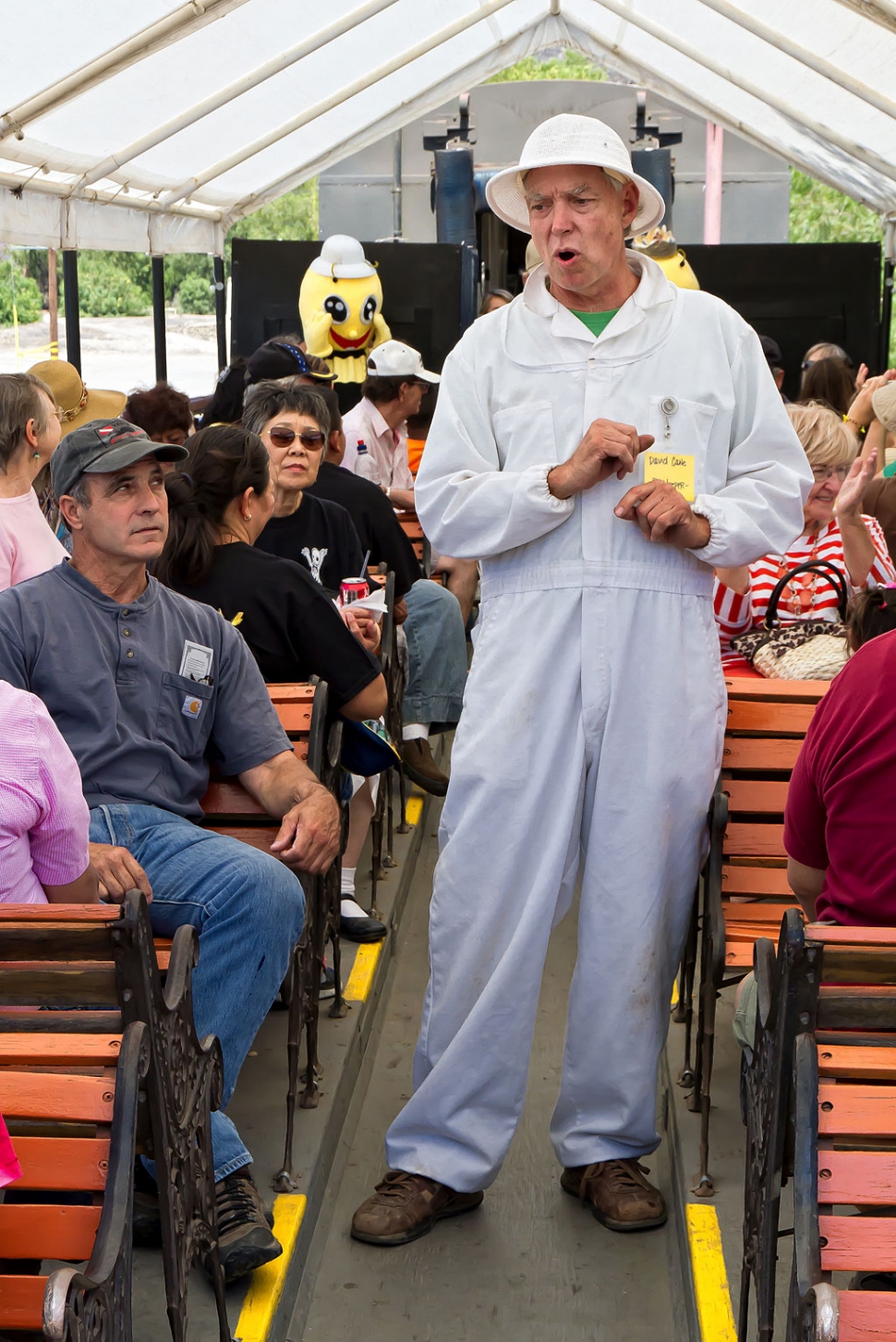 With nectarous bees buzzing about... best to always expect the unexpected at the Honey Harvest Festival.

Aboard an eastbound Fillmore & Western train destined for the Bennett Honey Farm near Piru, surprised passengers witnessed a posse of yellowjackets arrest Slurpy... a honey bee suspected of FUI (Flying Under the Influence). Slurpy not only had three unauthorized ‘pistils’ in his pouch… his nectar reading was a whopping 100 milligrams... a full 25 milligrams over the legal limit. Slurpy didn't resist knowing he was lucky to be nabbed by yellowjackets and not the... ahem... 'swat' team!

Back at the hive... the swarm was abuzz to learn that Slurpy was stung with a hefty fine by Judge Bumble Bee who also added 10 mandatory Nectars Anonymous fly-ins to the sentence. Ouch!

The otherwise uneventful train ride through a portion of the bucolic Heritage Valley was enjoyed under chamber-of-commerce-like blue skies. Upon arriving at Bennett's Honey Farm everyone was treated to a sweet tour of the honey facility. After seeing and learning about the honey-producing process... from raw honey extracted from the comb to the end product in the bottle... everybody leaves knowledgeable and with a greater appreciation for the invaluable work of the honey bees and that of people who prepare the honey for our consumption. And of course nobody leaves without a few jars of superb quality honey.  

Back in town... lines formed at the stands of oh-so-scrumptious barbeque. Barbie to drool for... so good and tasty no need for Tums... just a tummy! A little taste of this... a little taste of that... there's just no quitting... until maybe after the fifth round. Aaaaah.

Afterward... with tummy growlies squelched... lots of folks moseyed over to city hall and enjoyed some splendid musical entertainment. Listening to the musical notes wafting in the afternoon breeze… whoa... nah... that couldn't be Elvis... could it?

Aaaah yes... a sweet... sweet weekend. Though only the second annual Honey Harvest Festival it was a honey! At this rate... oh my... who can hardly wait until next year? In the meantime... watch out for those FUI bees that are also known to carry... ahem... ‘stigmas.’