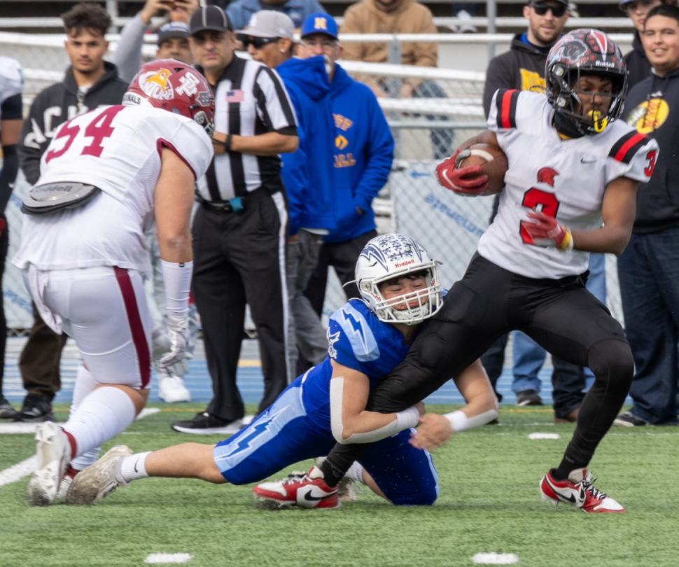 On Saturday, February 3rd, five Fillmore Flashes got a chance to play in the 50th Anniversary East vs. West Game at Camarillo as mentioned on page 1. Left is one of our Flashes making the tackle as the player tries to break away. Right is a Flashes receiving a handoff during Saturday’s game. Photo credit Crystal Gurrola. 