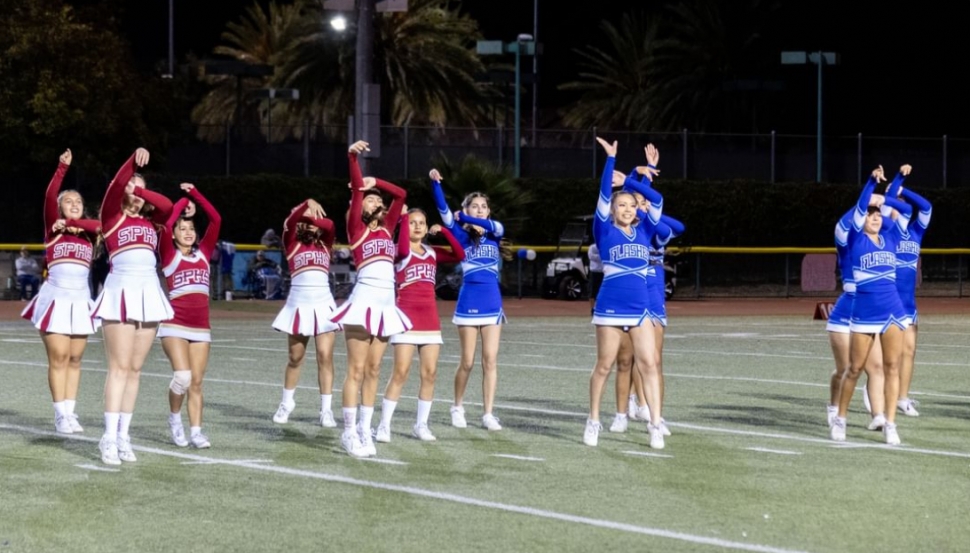 Above are the Cardinals and Flashes JV and Varsity Cheer Squads during their halftime performance. Photo credit Crystal Gurrola.