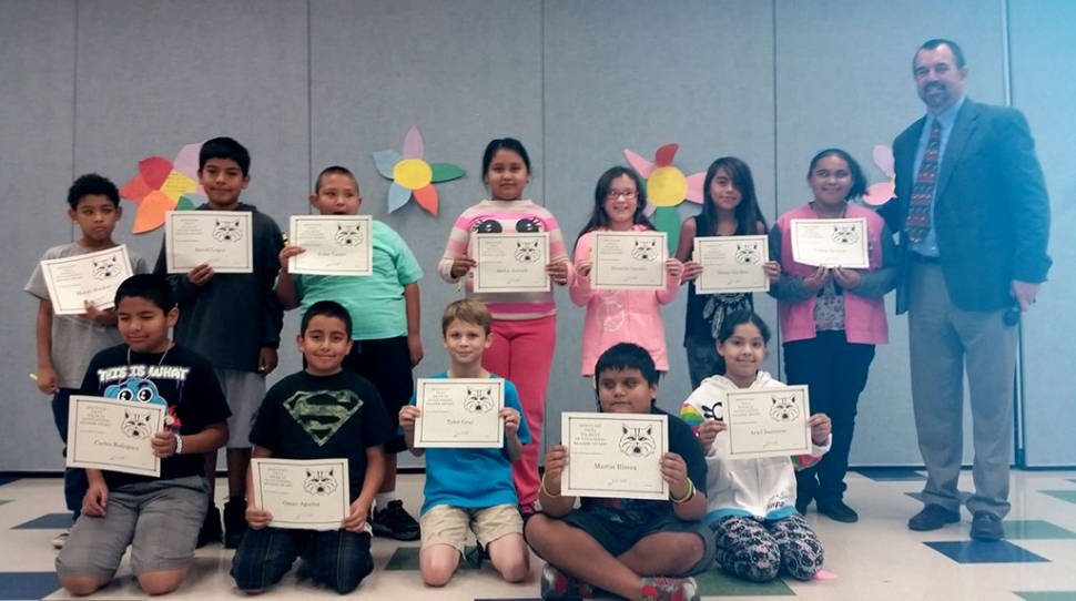 4th and 5th Graders Readers and Writers of the Month at Mountain Vista School. Pictured are Mahki Hooker, Carlos Rodriguez, David Lopez. Omar Aguilar, Isaac Casas, Martin Rivera, Jackie Arevalo, Tyler Gray, Daniella Garnica , Julissa Serrano , Nyssa Garibay, and Ariel Isarraras. Principal John Wilber pictured right.