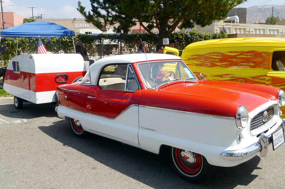 This sweet little 1959 Nash Metropolitan is pulling a matching teardrop trailer, ready to hit the road!
