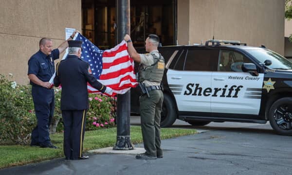 On Thursday, September 11th, the Fillmore Fire Department held a remembrance ceremony marking the 24th anniversary of the terrorist attacks on September 11th, 2001. Community members, dignitaries, and local officials gathered at 6:45 a.m. with the staging of fire and law enforcement apparatus on the station ramps. At 6:55 a.m., firefighters and sheriff deputies assembled at attention to raise the American flag to half-staff, followed by a moment of silence at 6:59 a.m. to honor the 2,977 lives lost that day. Photo credit Angel Esquivel.