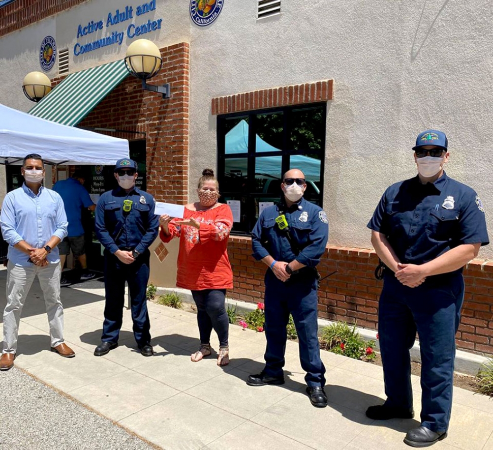 Pictured above is City Council Member Manuel Minjares, left, with an Fillmore Active Adult Center representative receiving a $500 check from Kaiser Permanente Ventura. Presenting the check was Ventura County Fire Station No. 27. Courtesy Fillmore City Council Member Manuel Minjares’ Facebook page.