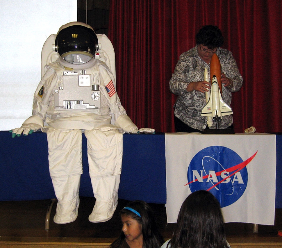 Beth White from NASA showcases an astronaut suit.
