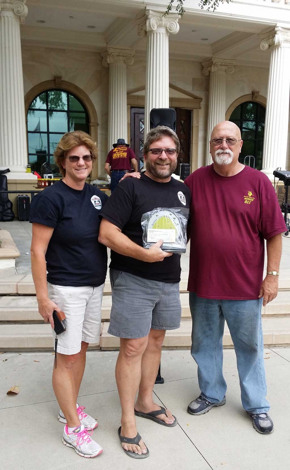 The 5th Annual California Honey Harvest Festival & BBQ Championship was held at Fillmore Central Park on June 11, 2016. In the BBQ Championship. Team “Blazed N’ Glazed”, Josh Weis and his wife, took First Place in pork butt with a near perfect score of 178.32 (180 is perfect). The Weises are from Simi Valley and this was their first win ever. This year’s championship had 27 pit masters, with 18 being Grand Champions at various contests around California. So this is serious bragging rights for the Weises. Presenting the award is Roger Campbell, right.