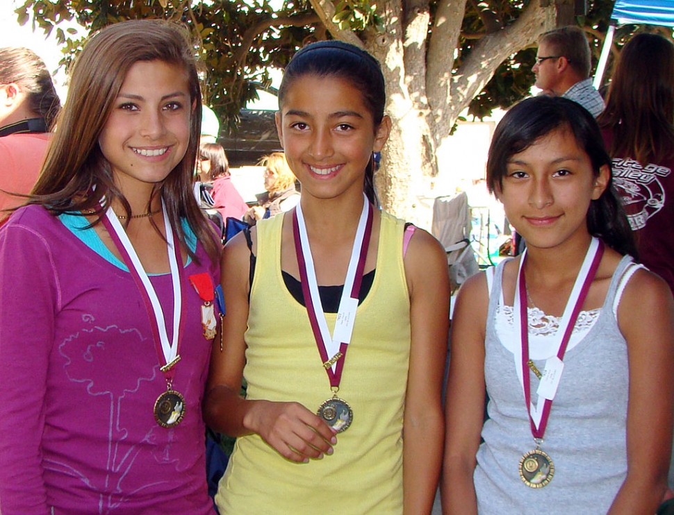 On Saturday May 22nd Kiana Hope, Nayeli Baez, and Irma Torres participated in the Ventura County Youth Track, Varsity Finals in Moorpark, winning medals at the Varsity Track finals. In order to participate at Varsity Finals you must qualify during the regular track season. All three girls run long distance, and are coached in Fillmore by Temo Laureano. In the Youth Division Kiana Hope placed 1st in the 3200 meter run and 2nd in the 1600 meter run. Nayeli Baez placed 3rd in the 3200 meter run. Irma Torres placed 1st in the 3200 meter run for her division, and also ran the 1600 meter run. Since the three girls did so well at Varsity Finals, they have qualified to run at the Conference Finals on June 5th in Carpinteria. Good job girls!