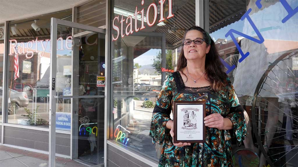 Cindy Largey from Ragtyme Station with her 1st place award for “Best Window Display Contest” at this year’s Dia De Los Muertos” (Day of the Dead) event which was held downtown November 2nd. Photo courtesy Diego Rodrigues. Congratulations to Cindy Largey from Ragtyme Station who won First Place in the Fillmore downtown merchant "Best Window Display" contest for Dia De Los Muertos" (Day of the Dead). The window display depicted a standing bride and a skeleton groom riding a vintage bicycle with their pet skeleton doggie holding a "Just Married" sign. The display filled the large window and the neon paint on the skeletons particularly stood out at night. On November 2, over 400 people attended the 4th Annual "Dia De Los Muertos" Day of the Dead celebrated, on Central Ave. in downtown Fillmore CA. Big Brothers & Big Sisters of Ventura County (BBBS) presented the event. BBBS would like to thank all the sponsors, volunteers, vendors and  other participants. A huge thank you to: Captain Dave Wareham, Pedro A. Chavez, Los Hermanos Herrera, Radio Lazer, DJ Limon, Ernie Villegas, Francisco's Fruits, La Fondita, E.J. Harrison & Sons, Inc., The Bumper Man. Inc., community members who created altar offerings, Jaime from The Fillmore Bicycle Hub, and to all of the Fillmore and Piru staff, elementary and high school students that participated. We would also like to thank the City of Fillmore, The Fillmore Chamber of Commerce for supporting the event and which proceeds will go towards student scholarships.