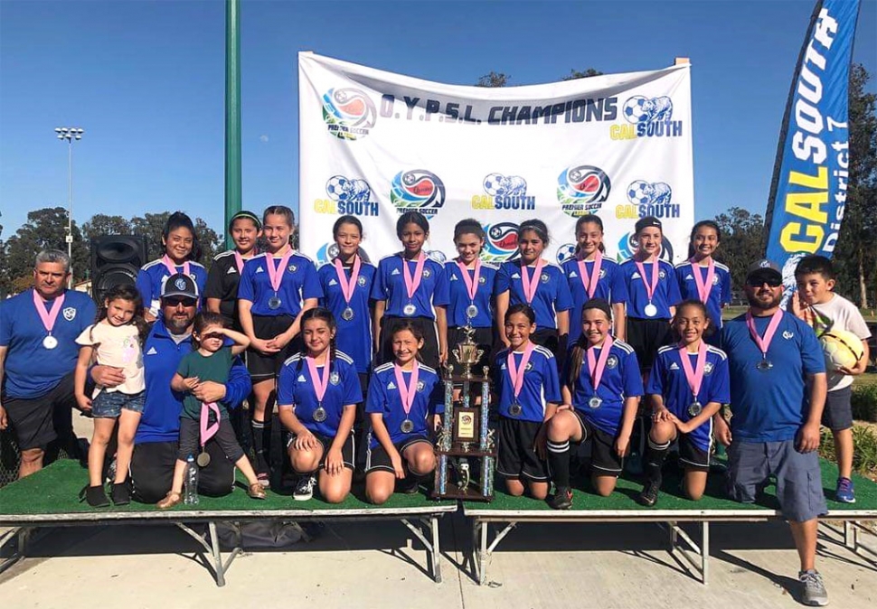 Congratulations to the California United FC 2006 Girls Silver team for taking second place in their division at the Premier Cup 2019 which took place March 16th & 17th in Oxnard. Pictured is the team after their win. Top row: Alexis Piña, Gabriela Martinez, Mikayla McKenzie, Lizbeth Mendez, Jadon Rodriguez, Athena Sanchez, Kim Manriquez, Jessica Rodriguez, Brooke Núñez, Miley Tello. Bottom Row: Coach Cip Martinez, Coach Jr Lomelí, Isabel Hernandez, Jazleen Vaca, Luvia Cabral, Karissa Terrazas, Victoria Piña, Coach Tony Hernandez. Photo courtesy Nancy Vaca.