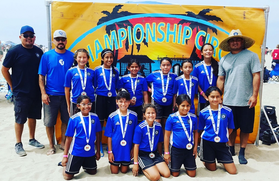 Pictured above is the California United FC 2008 Girls Soccer Team which finished as finalist in the Copa Cabana Beach Soccer Tournament in Huntington Beach this past week. Top row (l-r): Assistant Coach Asiano “Chano” Mendez, Assistant Coach John Cabral, Jazleen Vaca, Valerie Rubio, Delila Ramirez, Anel Castillo, Danna Castillo, Lizbeth Mendez, Head Coach David Vaca. Bottom row left to right: Joelle Rodriguez, Fiona Cabral, Leanna Villa, Sara Diaz and Alondra Leon. Not Pictured: Nathalia Orosco. Photo courtesy Nancy Vaca.