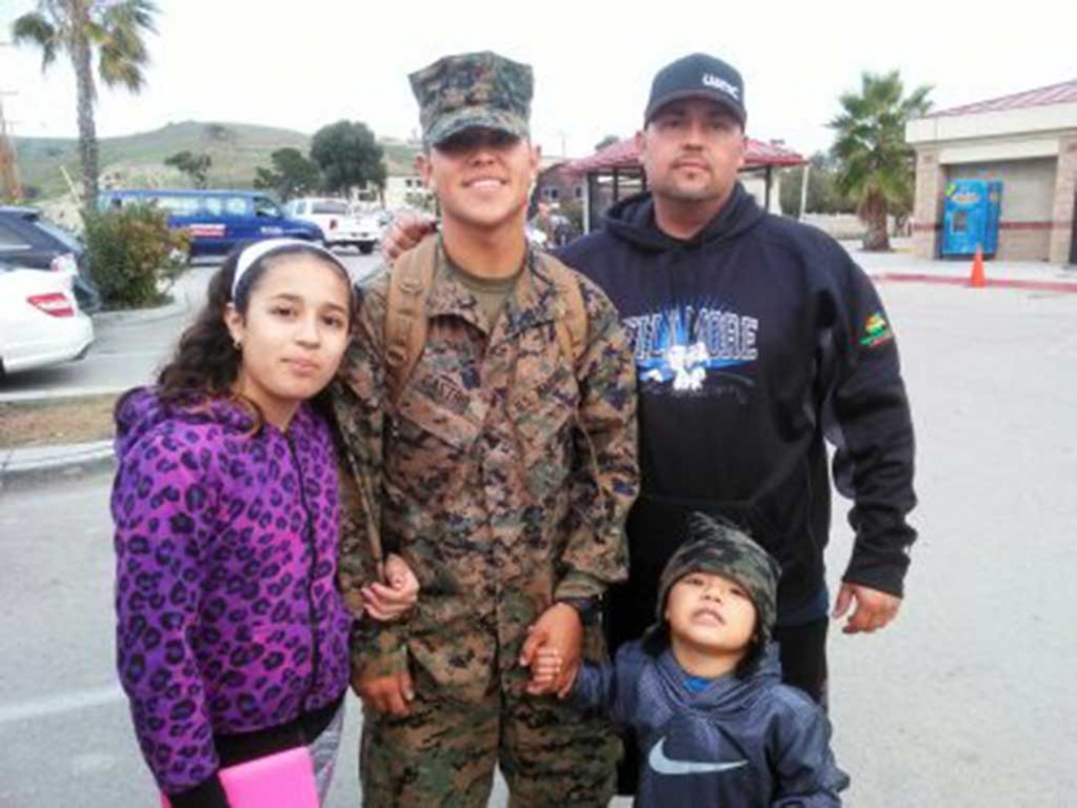 (above) Michael Castro and his family stop and smile for a photo to celebrate his promotion. Story and Photo Submitted by the Castro Family. I want to congratulate my son and F.H.S Grad Michael Castro (class of 2014). Michael was recently promoted to Lance Corporal. For the last few months Michael has been at Fort Benning in Georgia attending ABV (assault breacher vehicle) school this is Michael's 2nd MOS (military occupational specialty) earlier this year Michael graduated from Combat Engineering school as the class Guide. On Dec.16 Michael graduated ABV school as the class Honor Grad. Needless to say Michael is doing well for himself but more importantly he's representing F.H.S and Fillmore very well. In the few pictures he sends me in his civilian clothes Michael is always wearing his F.H.S wrestling sweatshirt, beanie or football shorts or UA so I know he has not forgotten where he came from and is proud of that fact. Michael is now back in So Cal at his new home, Camp Pendleton with his unit 1st Combat Engineer Battalion. Good luck to Michael and all of our young men and women serving our Country. Good job son!