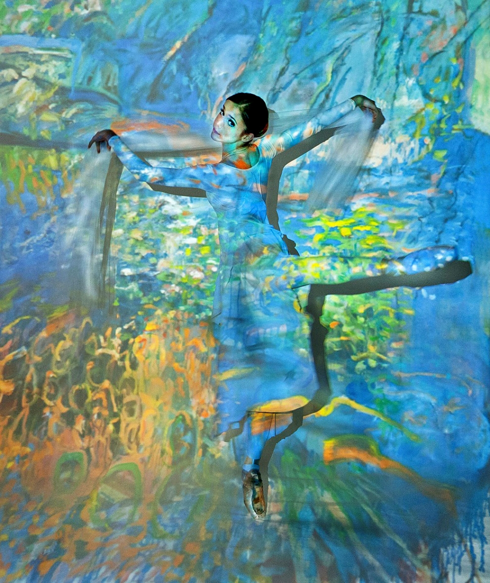 Victoria Smith dances as artwork by Gerd Koch is projected onto her. Photo: Donna Granata.
