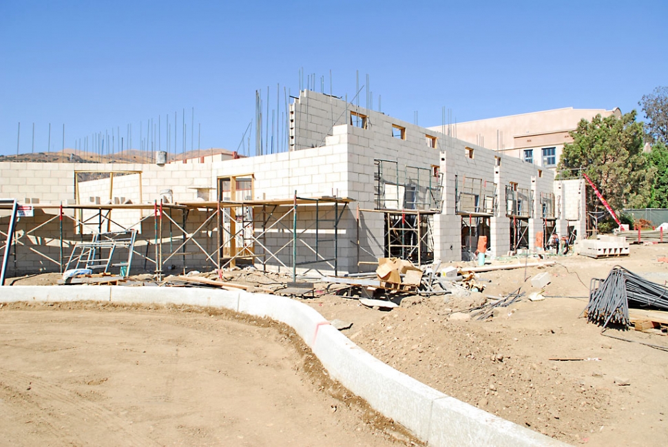 This photo shows the entrance way to the pool complex before being recently paved.