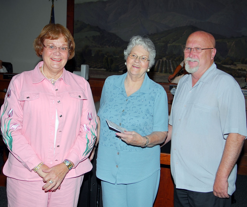 Shirley Spitler (left) and former Mayor Roger Campbell, hand Grad Night Live founder Raeleen Chaney checks for nearly $6,000 in support of this life-saving event. Illness has prevented Mrs. Chaney from fund-raising this year. Time is short and several thousand dollars more are needed to pay for the Fillmore High School senior grad night event.