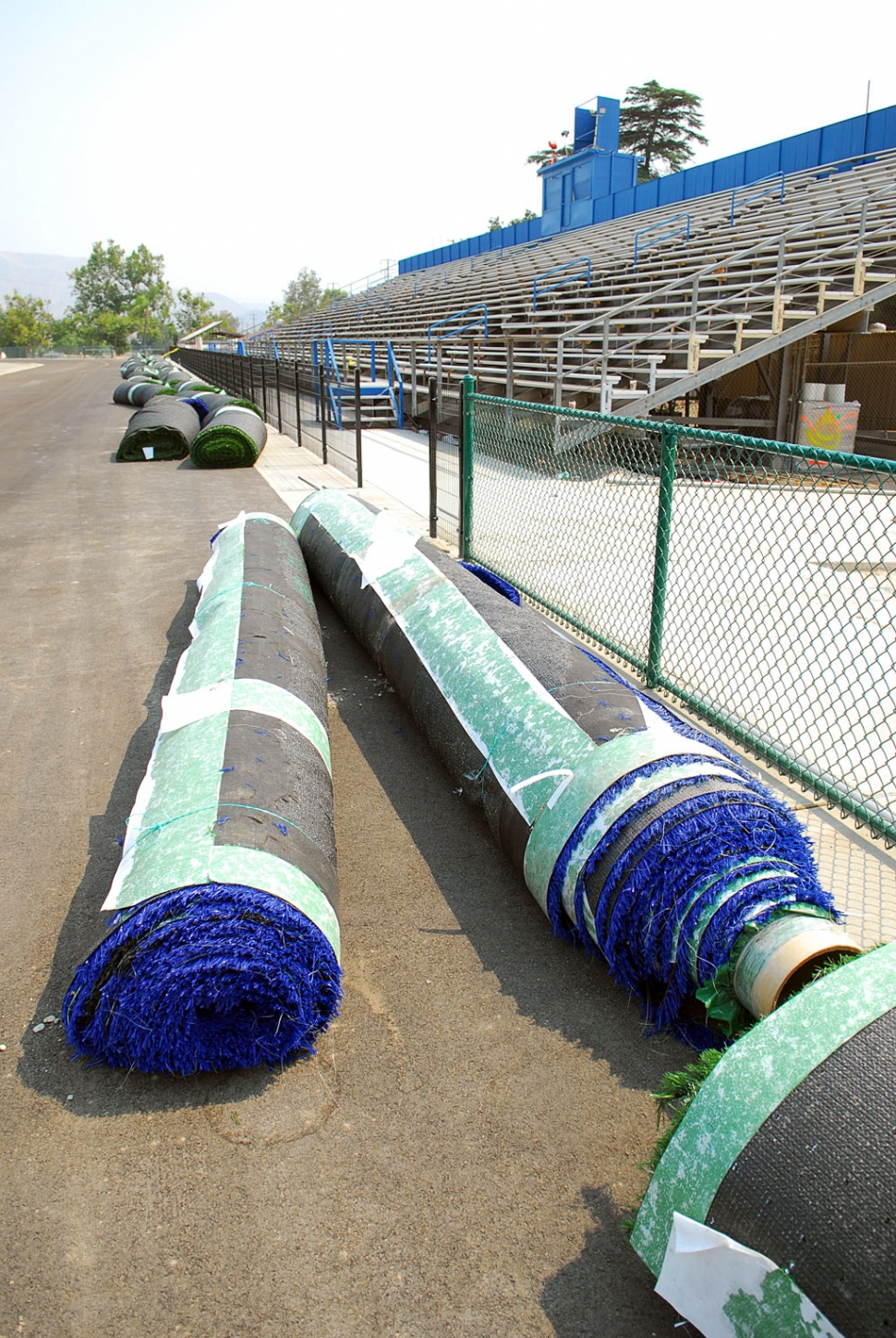 The football field's brand new artificial turf has been removed.