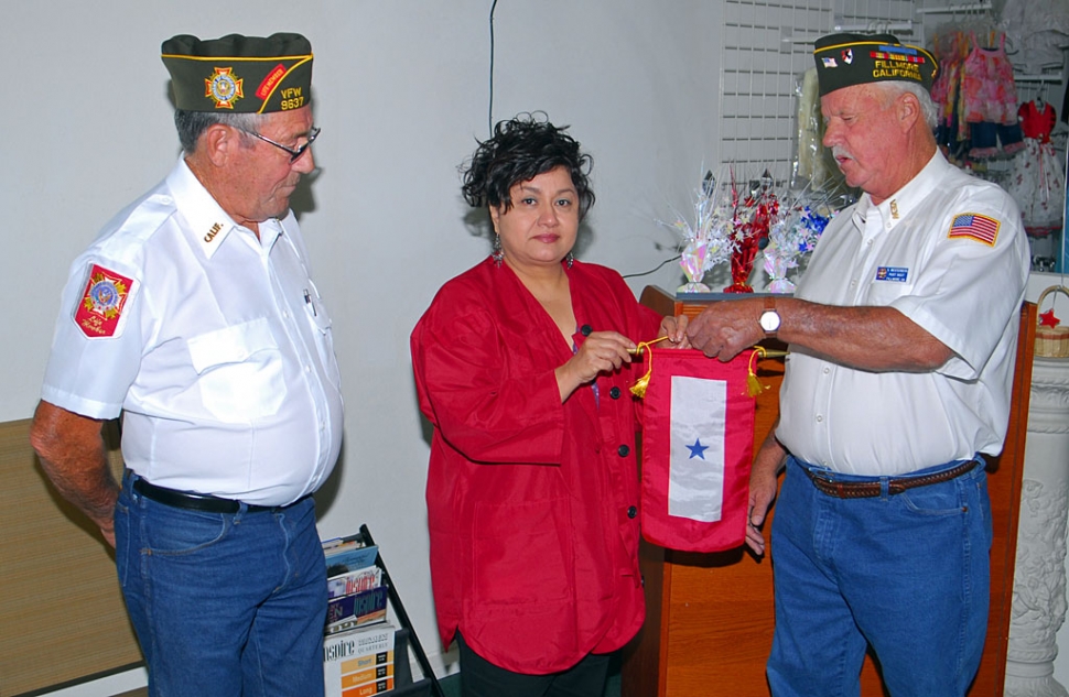 Commander Jim Rogers and Jr. Vice Commander Vic Westerberg, VFW Post 9637 Fillmore, CA, present a Blue Star Banner to Esperanza Hurtado, mother of Staff Sgt. Alfredo Hurtado Jr. “I would like to present you with this Blue Star Banner in honor of your son Staff Sgt. Alfredo Hurtado Jr. We would like to thank you and your family for all your sacrifices.” Note: Staff Sgt. Hurtado Jr. served in the United States Army in Mosul, Iraq in 2005 and received a Purple Heart& Bronze Star. He is now serving as a recruiter at Fort Guachuca, Arizona.