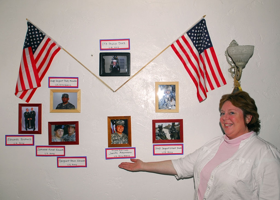 Mama Sue shows her display of the men and women of Fillmore and Piru who are serving in the United States Military.