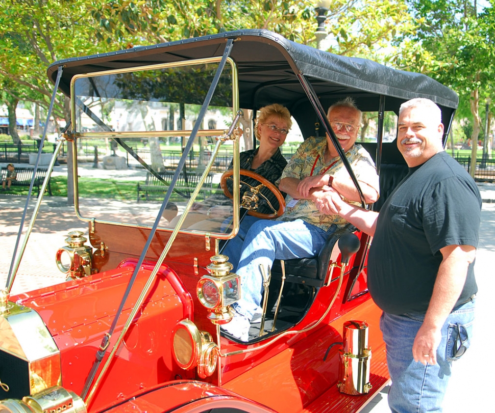 Mayor Steve Conaway greets members of the Southern California chapter of the Horseless Carriage Club of America in front of city hall. Club members paid an unexpected visit to Fillmore, Monday and treated residents to a glittering display of pre-1916 automobiles.