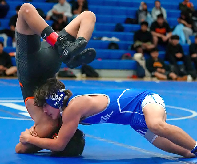 Above is Fillmore Flashes junior James Alcantar flipping his opponent during the match against Del Sol Jaguars this past Wednesday, November 12, at the FHS Gymnasium. Photo credit Daniel Cruz.