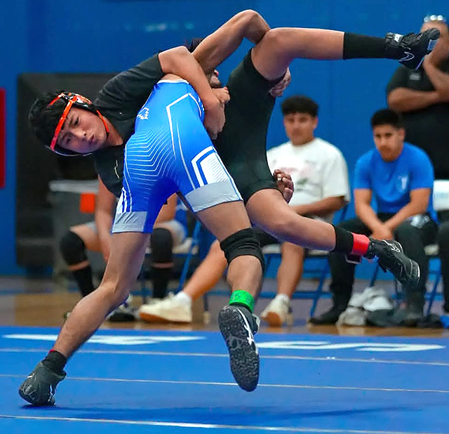 On Wednesday, November 12, FHS Boys Wrestling hosted Del Sol High School. Above is senior co-captain Tony Lemus lifting his opponent during the match. Photo credit Daniel Cruz. 