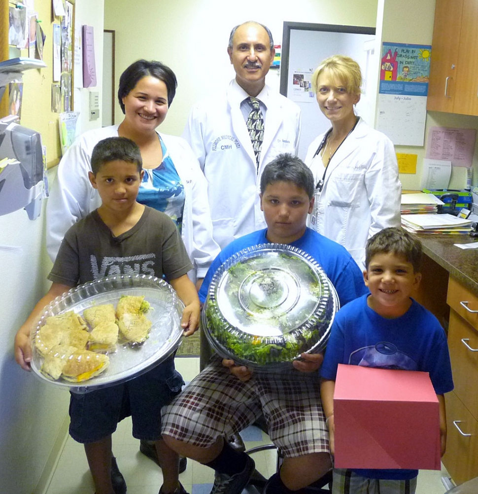 For the 10th consecutive year, Dr. Raymond Menchaca with CMH Centers for Family Health provided physicals for Fillmore Youth Football and Cheer, free of charge. The Fillmore Raiders Board of Directors thanks Dr. Menchaca and all of his staff for his generosity. The Raiders provided lunch for the medical staff on Monday. Pictured top row, P.A Sendi Flores, Dr. Raymond Menchaca, P.A. Bonnie Griffin. Bottom row, (l-r) Raider players Ricky, Sammy, and Joey Holladay.