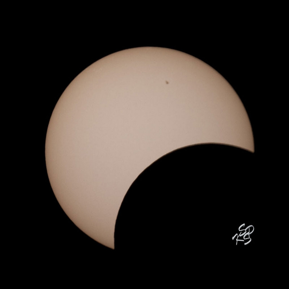 Images of Sunday's Annular Solar eclipse from Ivins, Utah by Charles Morris and Carmelita Miranda. This first image shows the moon starting to cover the Sun. Sunspots can easily be seen on the disk of the Sun.