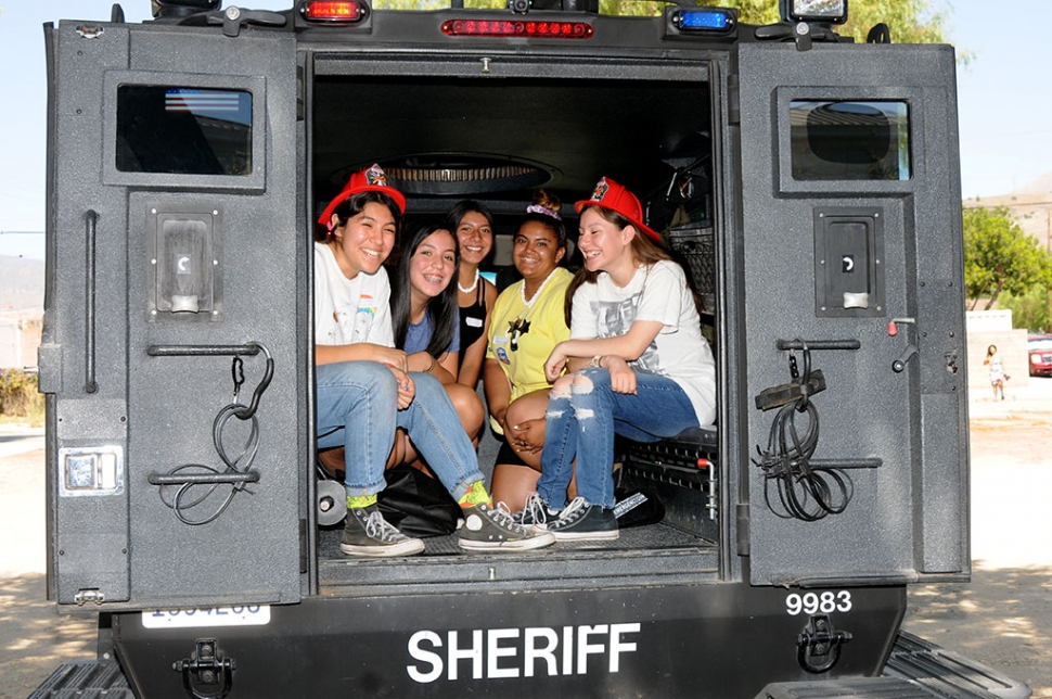 On Saturday, September 7th, the City of Fillmore hosted an Emergency Preparedness Day in Central Park from 10 a.m. to 2 p.m. They had emergency personnel and their vehicles on hand, and visitors could talk to real life heroes who respond to emergencies throughout Ventura County. In attendance were the US National Weather Service Los Angeles/Oxnard, United Water Conservation District, Fillmore City Fire Department, Tupperware, Pampered Chef, Damsel in Defense, Fillmore Volunteer Fire Departments Kids Safehouse, U.S. Forest Service, VC Fire Department, Pierce Brothers Santa Paula Cemetery, Anthem Blue Cross, SWAT, VC Sheriffs office , Bomb Squad, Lake Piru Rangers, VC OES, CA Department of Fish & Wildlife, Fillmore Citizens Patrol, Perez Family Funeral Home, AT&T, and more. Pictured above are some kids having fun sitting in an armored police vehicle at the Emergency Preparedness event this past Saturday, held in Central Park.